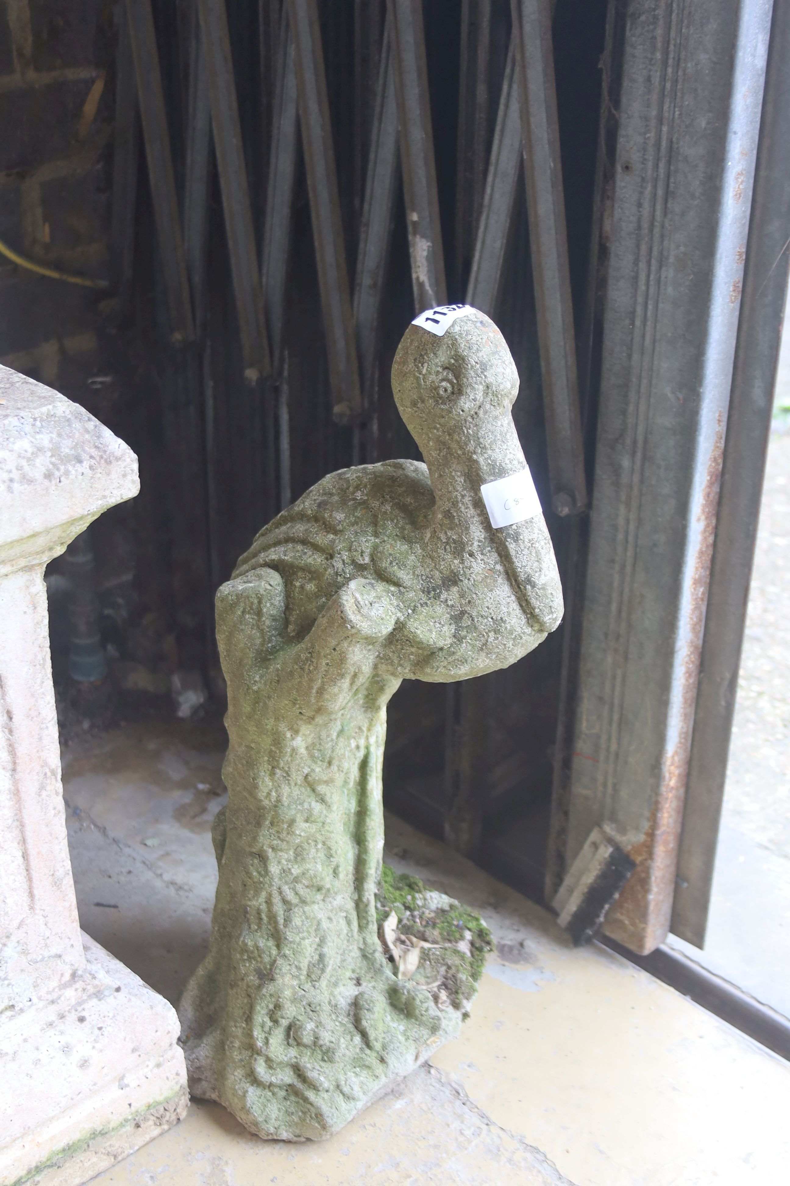 A reconstituted stone pelican garden ornament, height 53cm